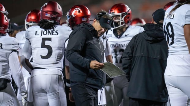 Cincinnati Bearcats head coach Scott Satterfield attempts to call a play following a touchdown in the fourth quarter of the NCAA Big12 football game between the Oklahoma State Cowboys and the Cincinnati Bearcats at Boone Pickens Stadium in Stillwater, Okla., on Saturday, Oct. 28, 2023.  
